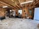 Functional garage with tool storage, work area, and an open layout, suitable for various activities at 413 Vasbinder Dr, Anderson, IN 46017