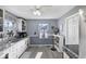 Bright kitchen featuring white cabinets, modern appliances, and lots of natural light at 413 Vasbinder Dr, Anderson, IN 46017