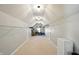 Attic with ample storage space and lighting with white walls and white shelving at 4707 Branch View Way, Indianapolis, IN 46234