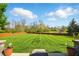 Large backyard featuring well-maintained lawn and wood fence at 4707 Branch View Way, Indianapolis, IN 46234