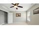 Bedroom with a ceiling fan, closet, and window with views at 4707 Branch View Way, Indianapolis, IN 46234