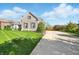 Lovely home with a long driveway, lush lawn, and beautiful landscaping around the property at 4707 Branch View Way, Indianapolis, IN 46234