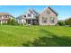 Attractive two-story home with brick and siding, showcasing a green lawn and curb appeal at 4707 Branch View Way, Indianapolis, IN 46234