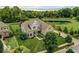 Beautiful two-story home with manicured lawn and landscaping, set on a corner lot with mature trees at 4707 Branch View Way, Indianapolis, IN 46234