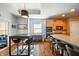 Spacious kitchen featuring a long island, a cooking space with wooden cabinets, and modern appliances at 4707 Branch View Way, Indianapolis, IN 46234