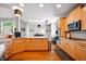 Modern kitchen with stainless steel appliances, light wood cabinets, and stylish lighting fixtures at 4707 Branch View Way, Indianapolis, IN 46234