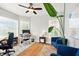 Well-lit home office with large windows, a desk, comfortable seating, and stylish decor at 4707 Branch View Way, Indianapolis, IN 46234