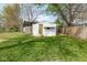 Spacious backyard featuring a functional shed and well-maintained lawn at 4814 Southeastern Ave, Indianapolis, IN 46203