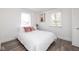 Bright bedroom with natural light, wood floors, and fresh decor at 4814 Southeastern Ave, Indianapolis, IN 46203