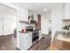 Bright kitchen with white cabinets, stainless steel appliances, and brick accent wall at 4814 Southeastern Ave, Indianapolis, IN 46203