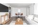 Bright living room with a cozy seating area, modern decor, and hardwood floors at 4814 Southeastern Ave, Indianapolis, IN 46203