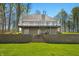 Beautiful backyard view showcases a two-story home, a large balcony, and a stone-walled garden at 4955 N 500 W, Columbus, IN 47201