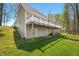 Spacious backyard featuring a two-story home with a balcony, and a lush green lawn at 4955 N 500 W, Columbus, IN 47201