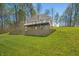 Beautiful exterior view of home with balcony overlooking expansive green lawn and natural surroundings at 4955 N 500 W, Columbus, IN 47201