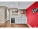 Basement bar area with a white countertop, a wine cooler, and hardwood floors at 4955 N 500 W, Columbus, IN 47201