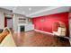 Basement bar area with a white countertop, wine cooler, and a red accent wall at 4955 N 500 W, Columbus, IN 47201