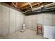 Unfinished basement with concrete walls, exposed ceiling, and space for storage at 4955 N 500 W, Columbus, IN 47201