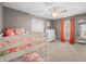Bedroom with bunkbeds, carpeted floor, neutral walls, ceiling fan, and white dresser at 4955 N 500 W, Columbus, IN 47201