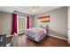 Cozy bedroom showcasing a comfortable bed, and a bright window at 4955 N 500 W, Columbus, IN 47201