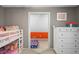 Bedroom features a neutral wall color and flows to another room with an orange accent wall at 4955 N 500 W, Columbus, IN 47201