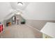Bright bonus room with neutral carpet, a ceiling fan, and a basketball hoop at 4955 N 500 W, Columbus, IN 47201