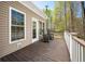 Inviting deck with rocking chairs, wood floors, and scenic views of the surrounding nature at 4955 N 500 W, Columbus, IN 47201