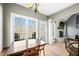 Dining area with large windows that let in lots of natural light and a cozy fireplace at 4955 N 500 W, Columbus, IN 47201