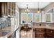 Bright dining area with large windows and a view of the outdoors with access to the deck at 4955 N 500 W, Columbus, IN 47201