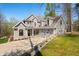 A large two-story home with a lush lawn, stone retaining wall and a two-car garage at 4955 N 500 W, Columbus, IN 47201