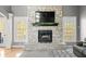 Close-up of the stone fireplace with a mounted TV and mantel at 4955 N 500 W, Columbus, IN 47201