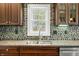 Granite countertops and stone backsplash add character to this kitchen at 4955 N 500 W, Columbus, IN 47201