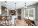 Spacious open-concept kitchen and dining area with granite counters, bar seating, and natural light at 4955 N 500 W, Columbus, IN 47201