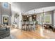 Open-concept living room with bar, dining area, and soaring ceilings for a bright and airy feel at 4955 N 500 W, Columbus, IN 47201