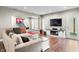 Basement living room features cozy seating area, entertainment center, and hardwood floors at 4955 N 500 W, Columbus, IN 47201