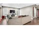 A spacious basement living room with hardwood floors, a TV, and neutral paint at 4955 N 500 W, Columbus, IN 47201