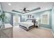 Serene main bedroom with tray ceiling, light blue walls, and French doors at 4955 N 500 W, Columbus, IN 47201
