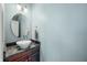 Stylish powder room featuring a unique vessel sink, granite countertop, and modern fixtures at 4955 N 500 W, Columbus, IN 47201