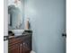 Stylish powder room featuring a unique vessel sink, granite countertop, and modern fixtures at 4955 N 500 W, Columbus, IN 47201