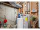 Basement utility room with water heater, water filtration system, and exposed ceiling at 4955 N 500 W, Columbus, IN 47201
