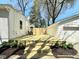 Newly-constructed backyard deck featuring stairs and privacy fence at 5135 N Kenwood Ave, Indianapolis, IN 46208