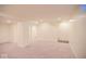 Expansive basement area with neutral carpeting, creating a versatile space for various uses at 5135 N Kenwood Ave, Indianapolis, IN 46208