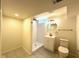 Bright bathroom with standing shower, toilet and custom modern vanity at 5135 N Kenwood Ave, Indianapolis, IN 46208