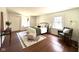 Bright, well-appointed bedroom with hardwood floors, neutral decor, and ample natural light at 5135 N Kenwood Ave, Indianapolis, IN 46208