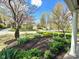 Inviting front yard showcasing manicured landscaping and flowering trees at 5135 N Kenwood Ave, Indianapolis, IN 46208