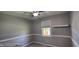 This is a cozy bedroom with neutral paint, updated fixtures, and lots of light at 5444 S Holiday Dr, Columbus, IN 47203