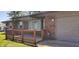 Inviting brick home with a charming front porch adorned with potted flowers at 5444 S Holiday Dr, Columbus, IN 47203
