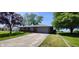 Charming brick home with a well-maintained lawn and a cozy front porch at 5444 S Holiday Dr, Columbus, IN 47203