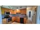 Well-equipped kitchen featuring wooden cabinets and stainless steel appliances at 5444 S Holiday Dr, Columbus, IN 47203