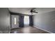 Bright living room featuring hardwood floors, a ceiling fan, and natural light at 5444 S Holiday Dr, Columbus, IN 47203
