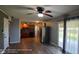 Bright living space connecting the kitchen to the living area with a ceiling fan at 5444 S Holiday Dr, Columbus, IN 47203